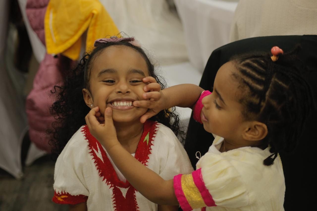 Two girls laughing together