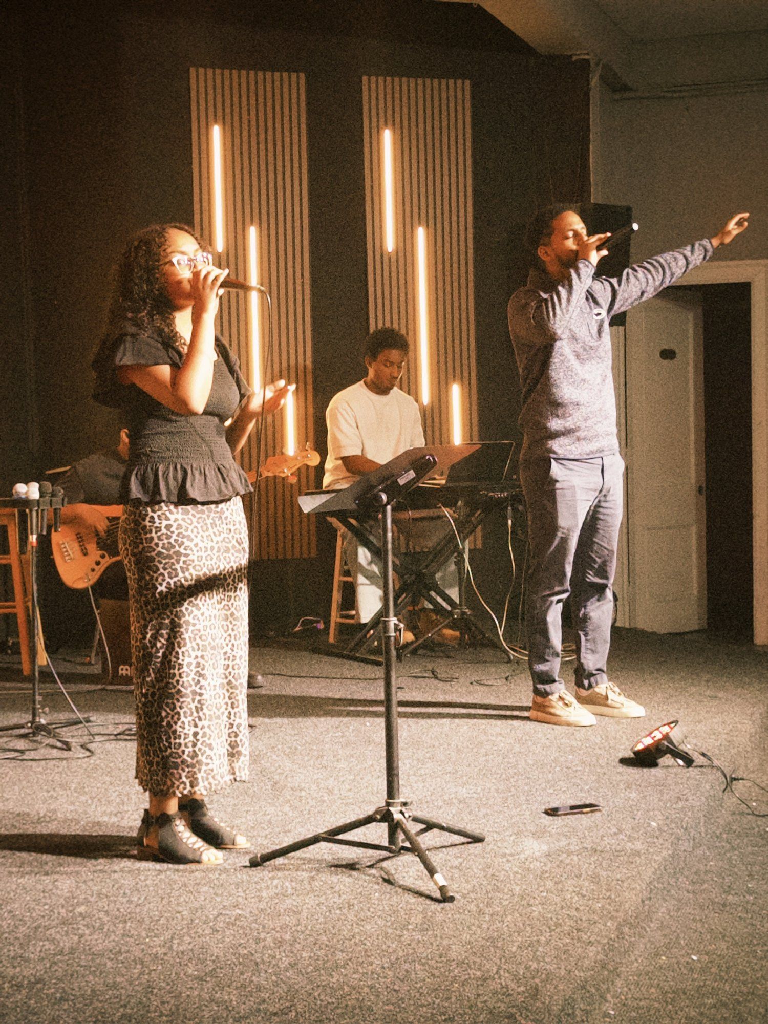 Worship leader with hand raised